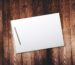 A blank sketchbook open on a table